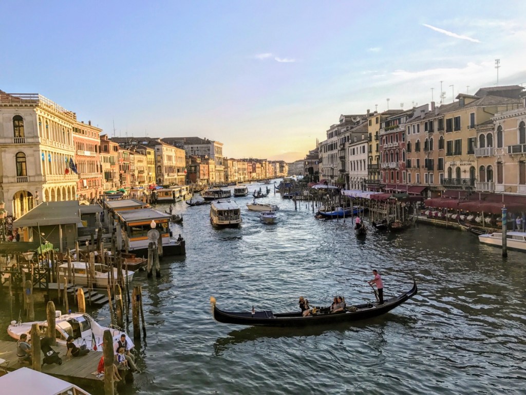 A gondola in the middle of the Grand Canal